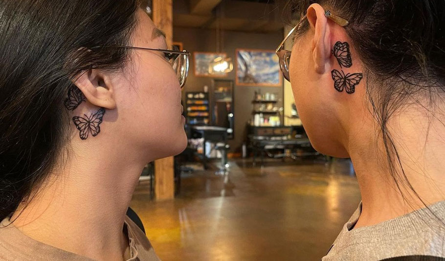 Butterfly tattoo behind ear
