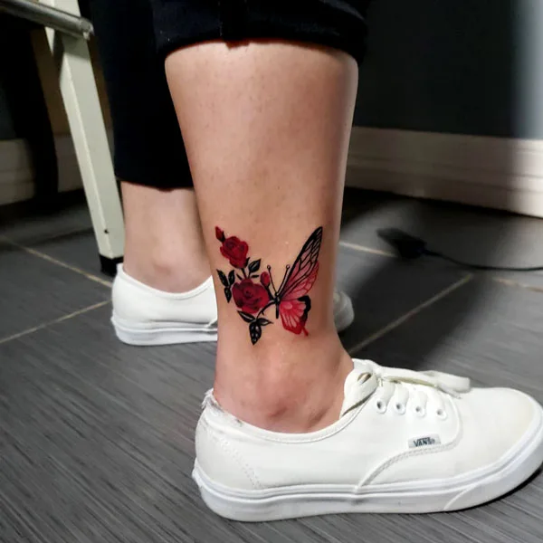 Half butterfly half flower ankle tattoo