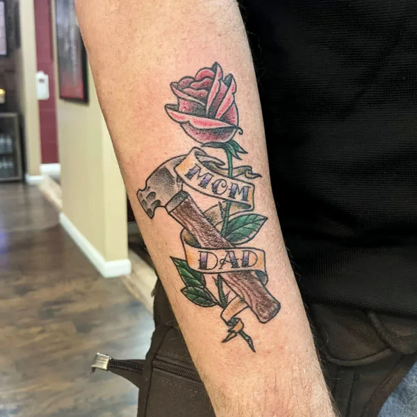 Mom and dad tattoos on forearm