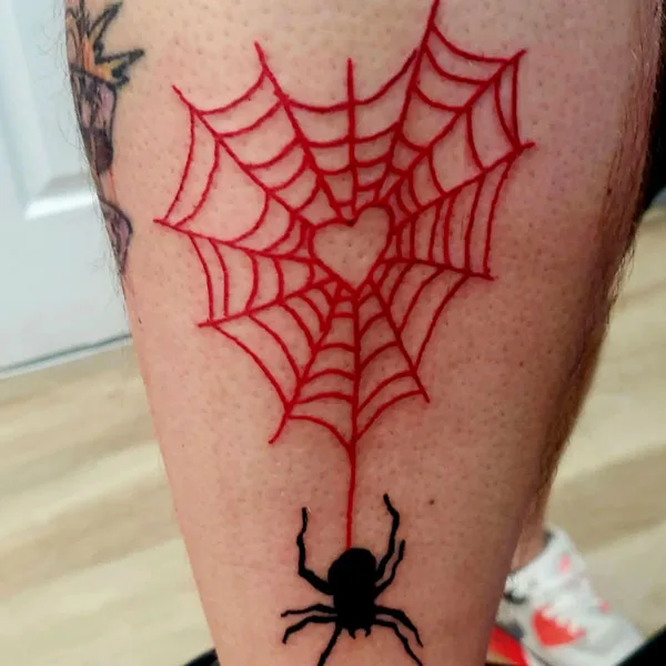 Red spider web tattoo