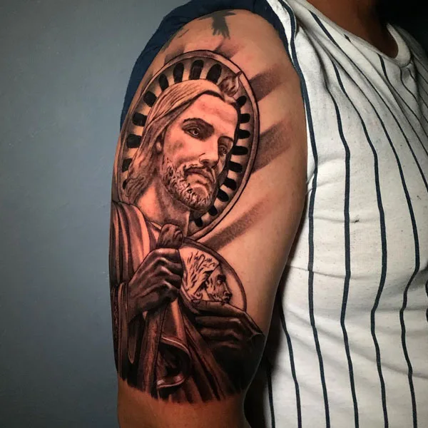San Judas tattoo on arm