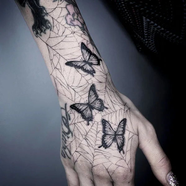 Spider web butterfly tattoo