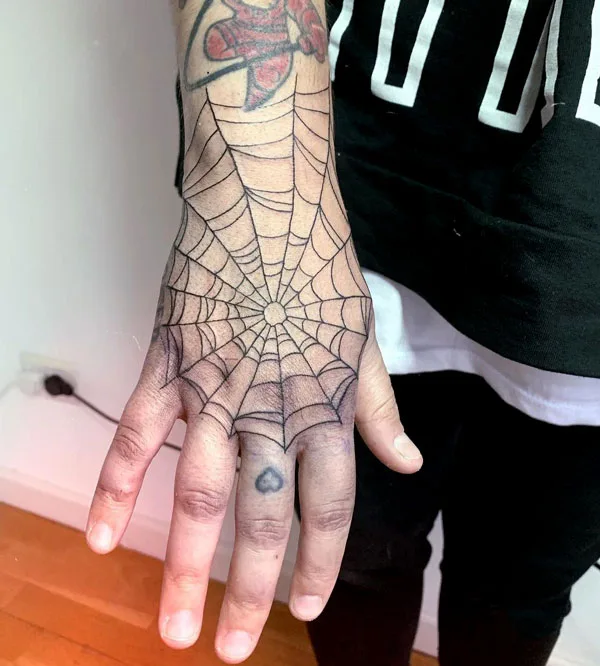 Spider web hand tattoo