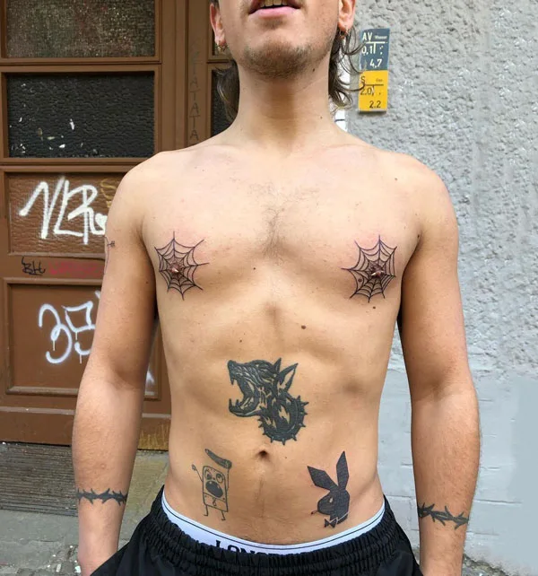 Spider web nipple tattoo
