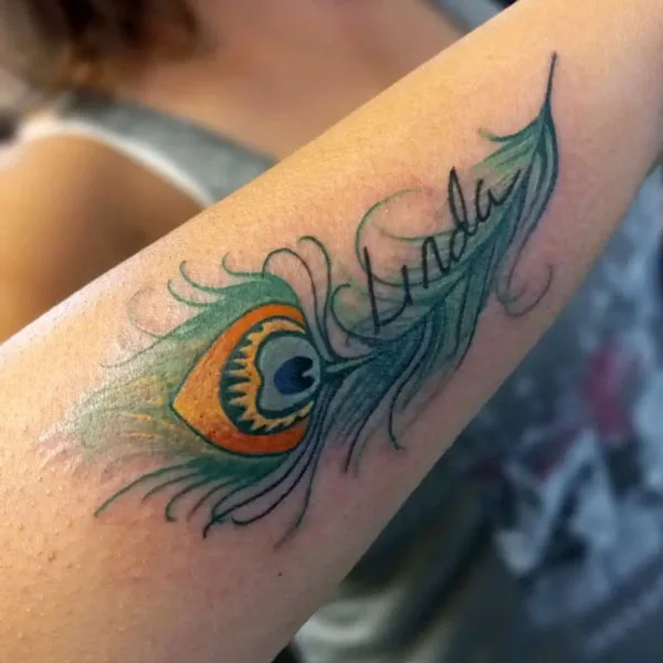 Peacock feather tattoo with name