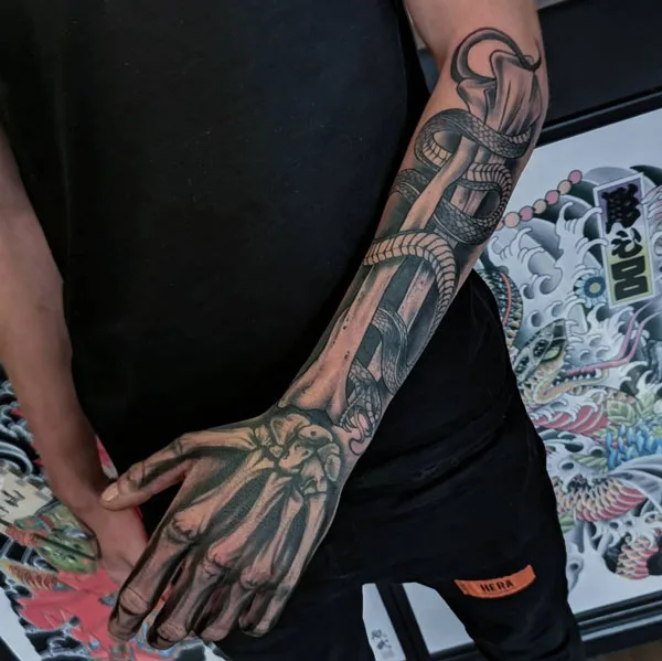 Skeleton hand tattoo 1