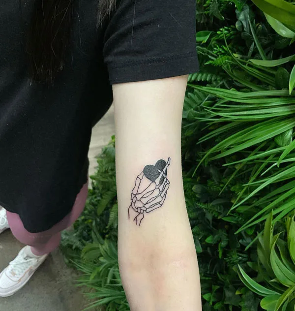 Skeleton hand tattoo 7