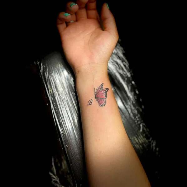 Small butterfly tattoo on wrist