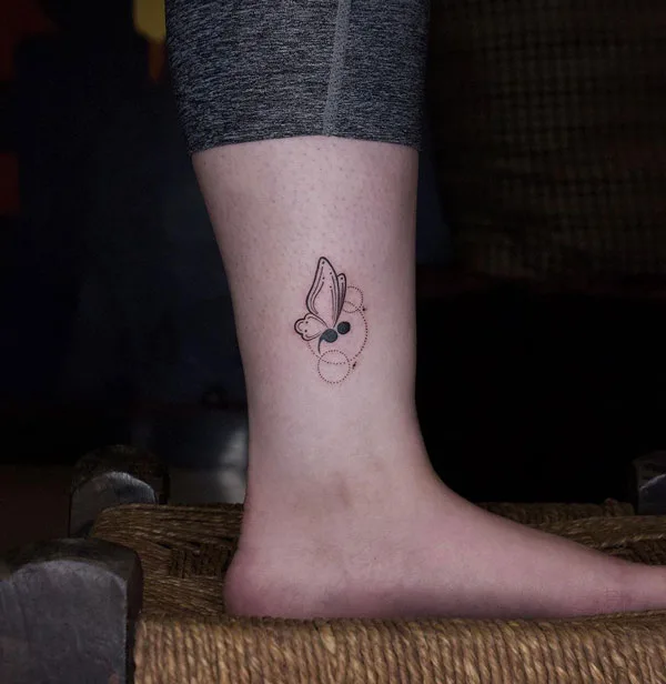 Small semicolon butterfly tattoo