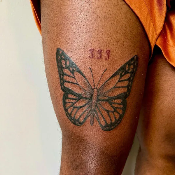 333 butterfly thigh tattoo
