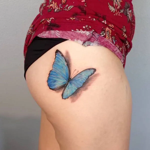 3D butterfly thigh tattoo