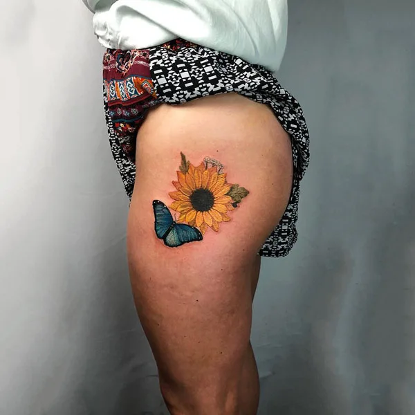 Butterfly thigh tattoo 11