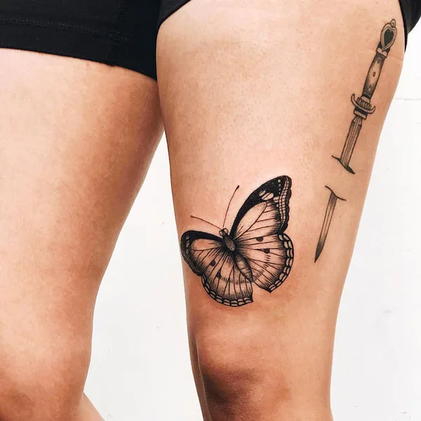 Butterfly thigh tattoo 12