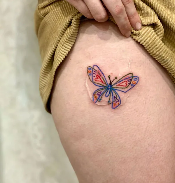 Butterfly thigh tattoo 17