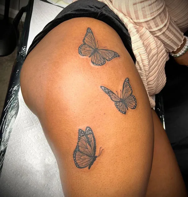 Butterfly thigh tattoo 20