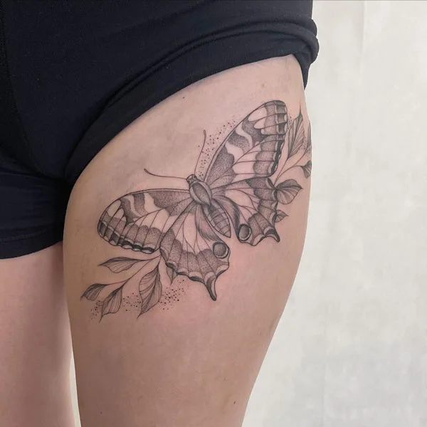 Butterfly thigh tattoo 33
