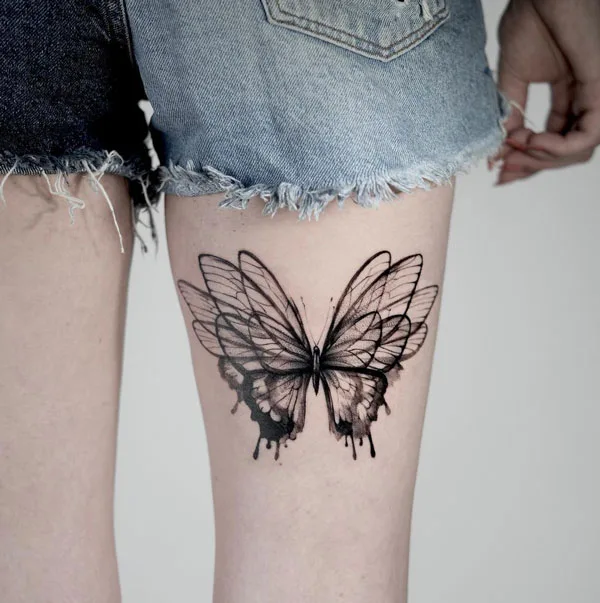 Butterfly thigh tattoo 34