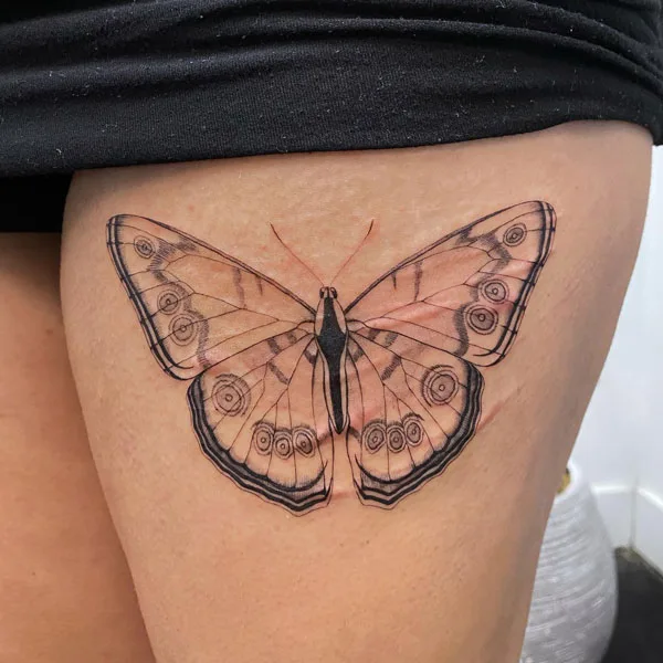 Butterfly thigh tattoo 40