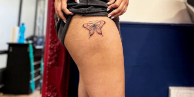 Butterfly thigh tattoo