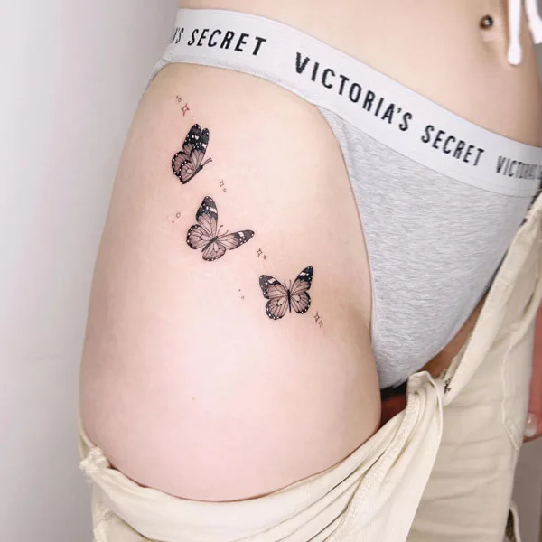 Butterfly thigh tattoo 56