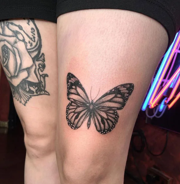 Butterfly thigh tattoo 59