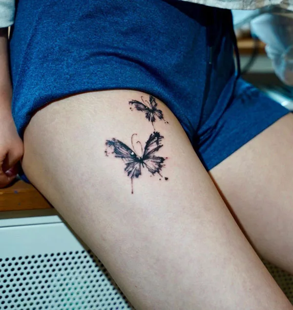 Butterfly thigh tattoo 75