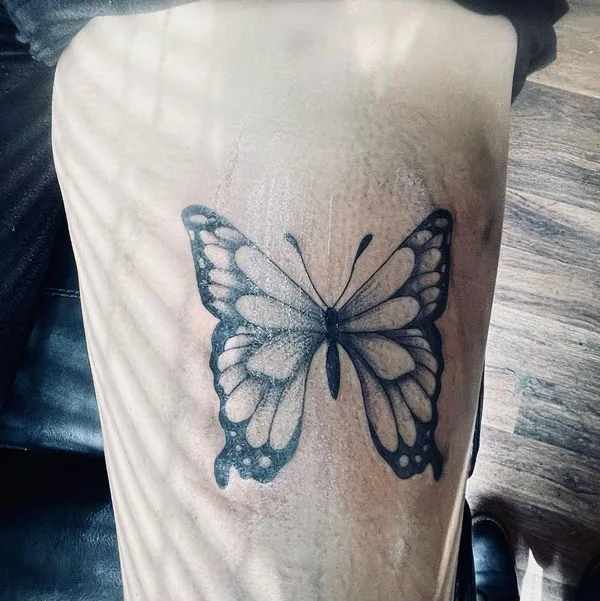 Butterfly thigh tattoo 84