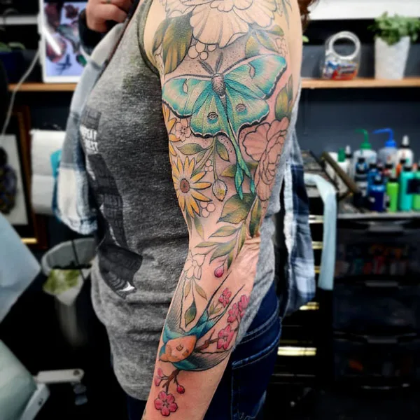 Luna Moth sleeve tattoo