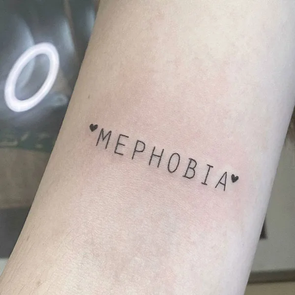 Mephobia arm tattoo
