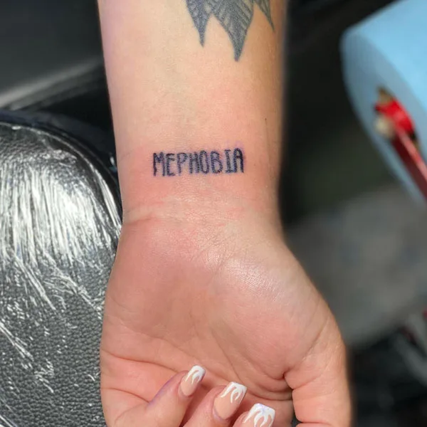 Mephobia wrist tattoo