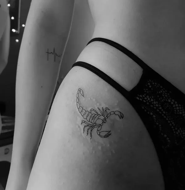 Bikini line scorpion tattoo
