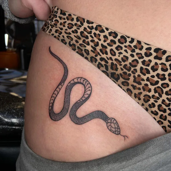 Bikini line snake tattoo