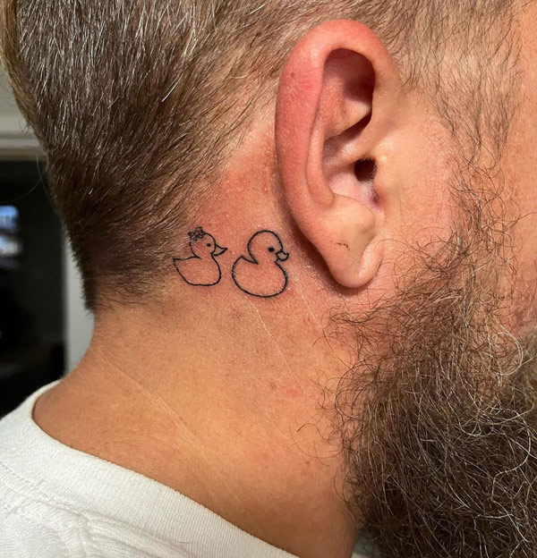 Ducky tattoo behind the ear