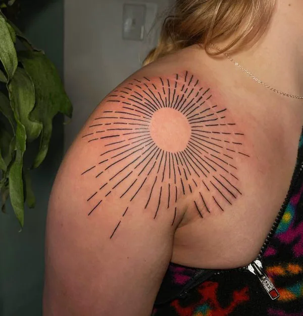 Sun with rays shoulder tattoo