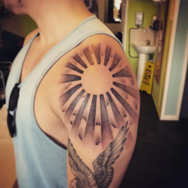 Sun with rays tattoo 5