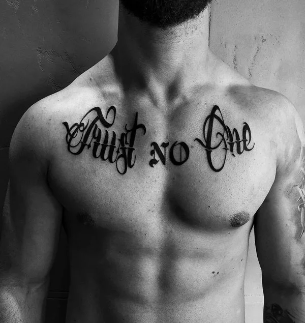 Trust no one chest tattoo