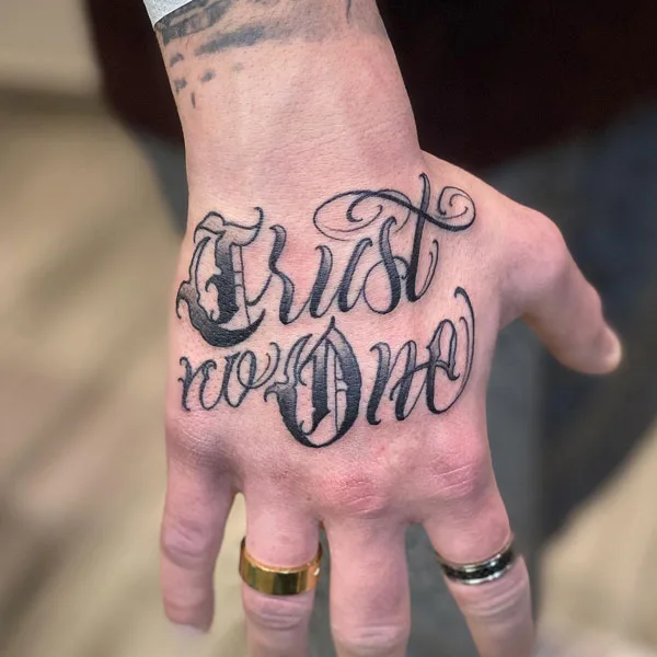 Trust no one hand tattoo