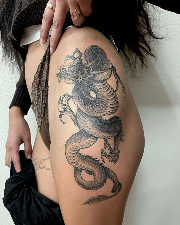Dragon tattoo on thigh 9