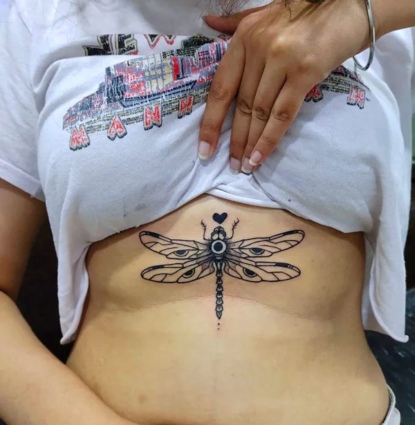 Dragonfly sternum tattoo