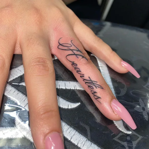 Heartless tattoo on finger