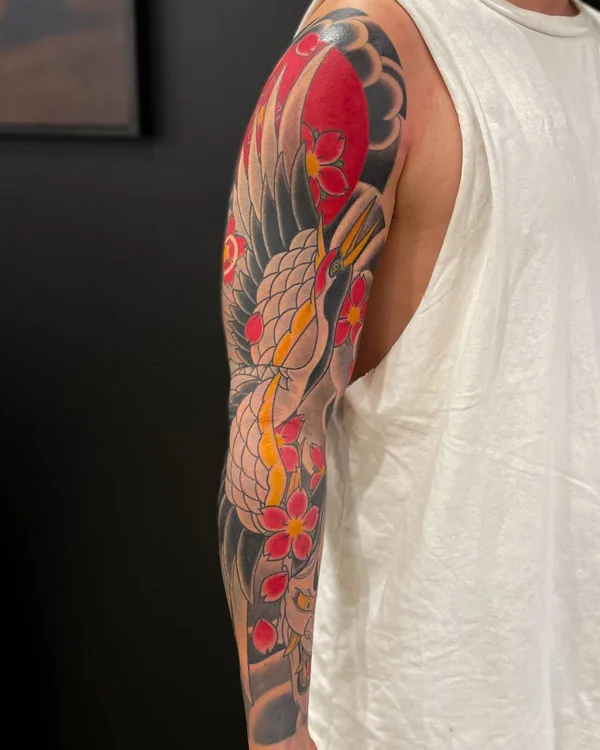Japanese crane tattoo on sleeve