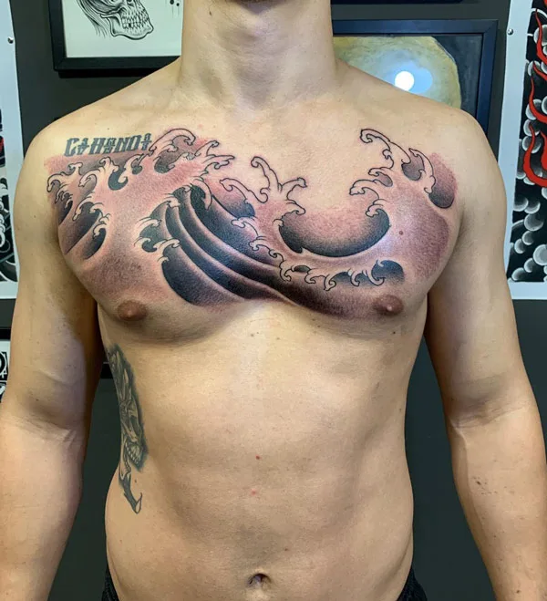 Ocean wave tattoo on chest