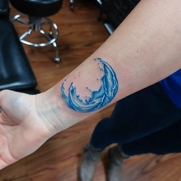 Ocean wave tattoo on wrist