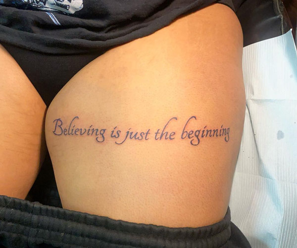 Quotes tattoo on thigh