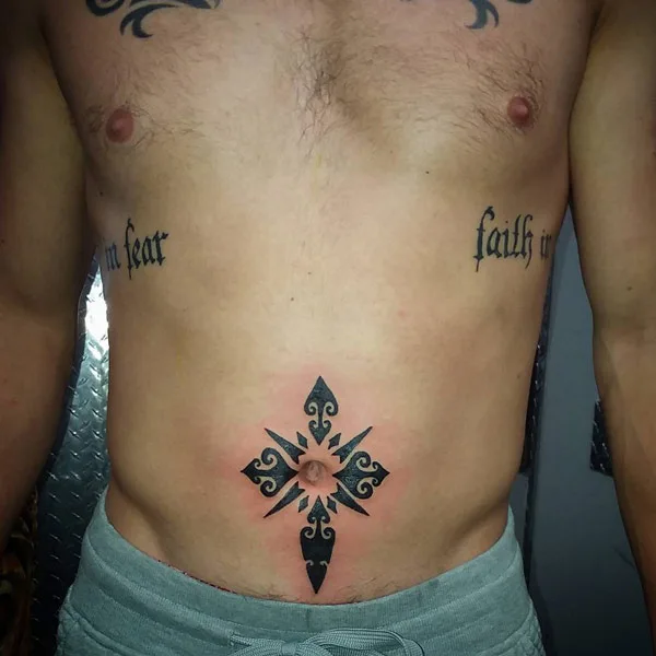 Tribal belly button tattoo