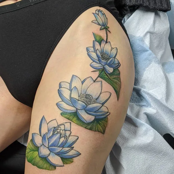 Water lily tattoo on thigh