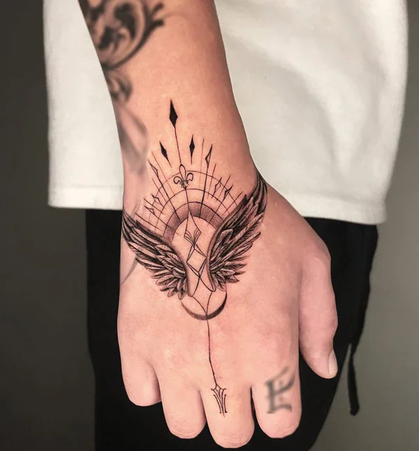 Angel wings tattoo on hand 2