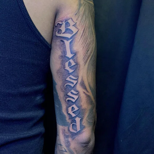 Blessed tattoo on arm 1