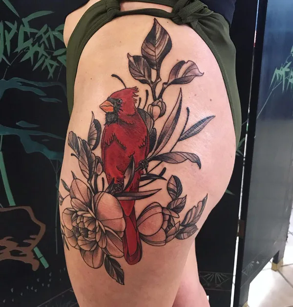 Cardinal tattoo on thigh