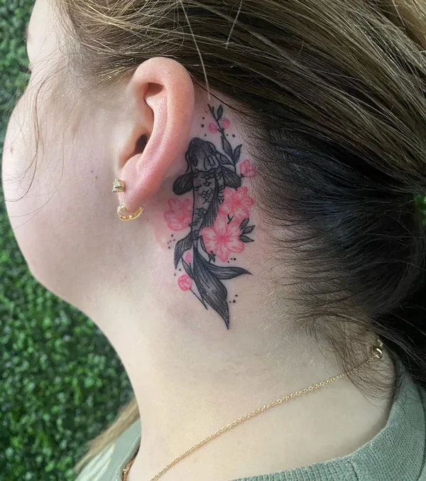 Koi fish tattoo behind the ear